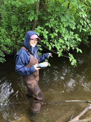 Brianna DeGone working in the Kennebunk River.