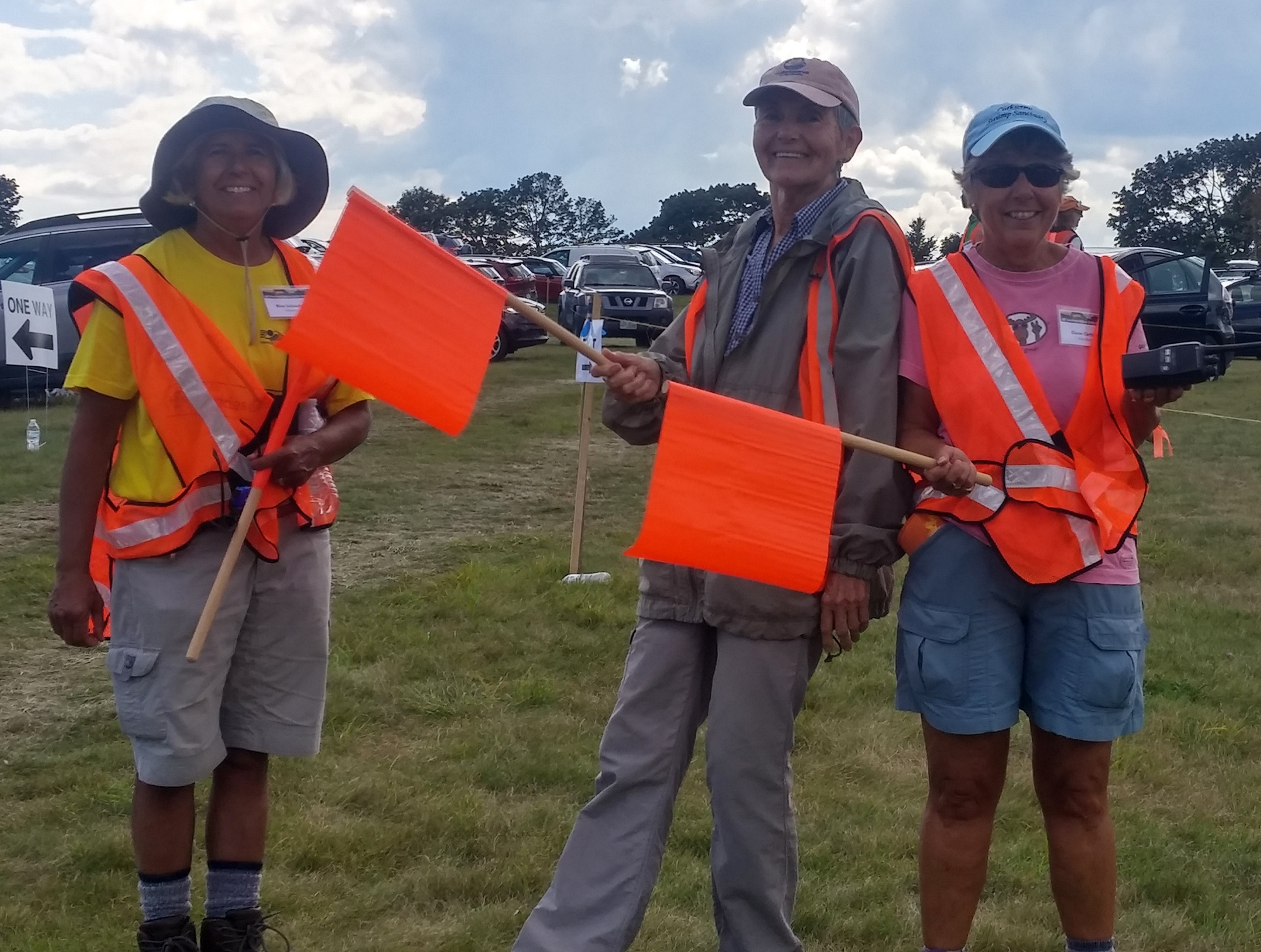 Parking volunteers Bina Salvador, Heidi Hubbard, and Diane Carfora relax for a moment. Photo by Lynne Vachon. 