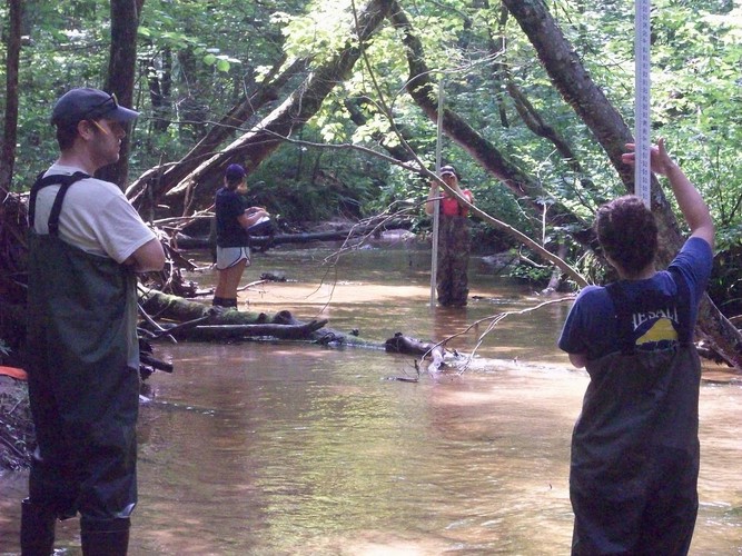 Jake Aman supervises as Research Interns Rachel, Clancy and Cat perform a habitat assessment.