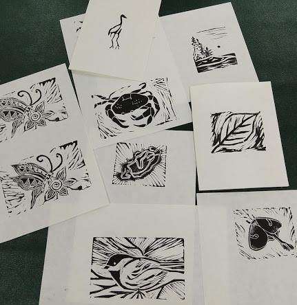 Samples of block print art created during the Hog Island Educator's Week.