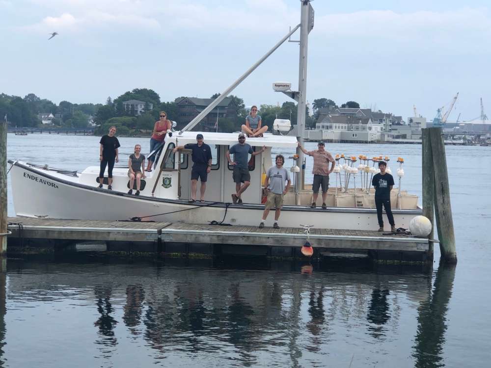 The ocean drifter assembly crew with the fully loaded Endeavor, the UNH boat that carried 24 drifters offshore for deployment on June 25. Photo: Thomas Lippmann/UNH