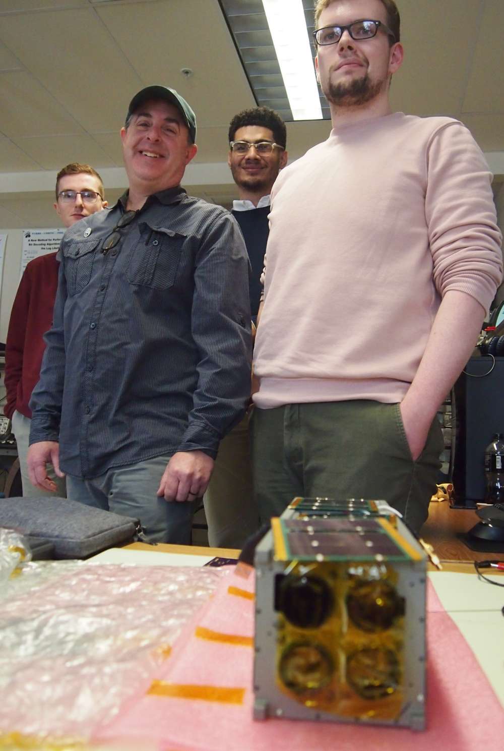 Dr. Jason Goldstein with MESAT1 and the project team. Photo: Scott Richardson