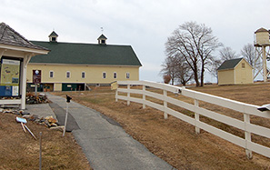 The entry walk, heading past the kiosk toward the big barn.