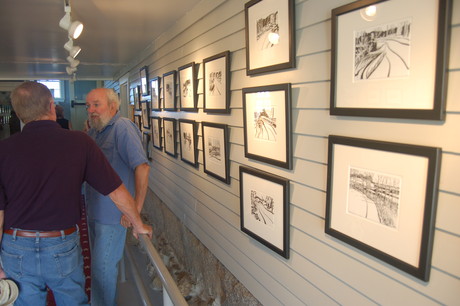 Artist George Burk and his brush and ink paintings