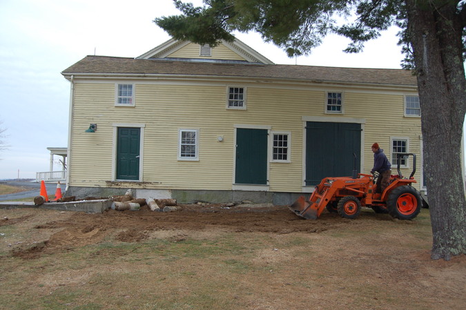 The concrete footings are removed and the ground is smoothed.